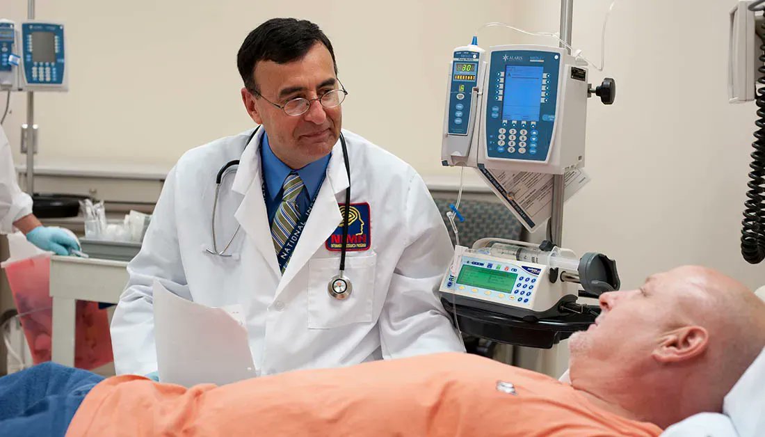 Dr. Carlos Zarate talks with a patient participating in a clinical trial