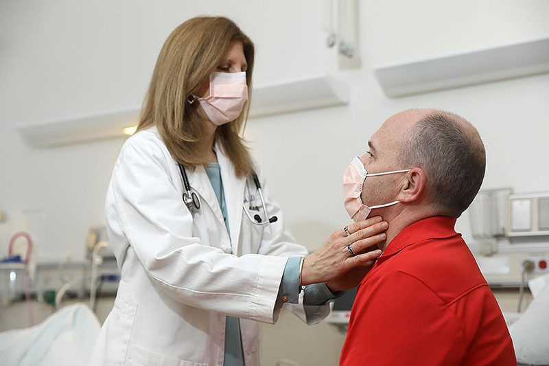 NIDCR Senior Research Physician, Rachel I. Gafni, M.D., examines a clinical trial participant with ADH1