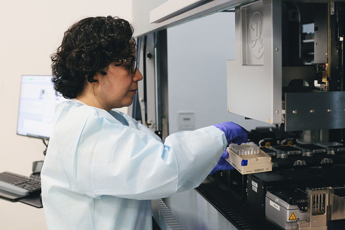 Erika Lara Flores, lead of the Automated Cell Culture expert group at CARD, works on CARD’s cell culture robot