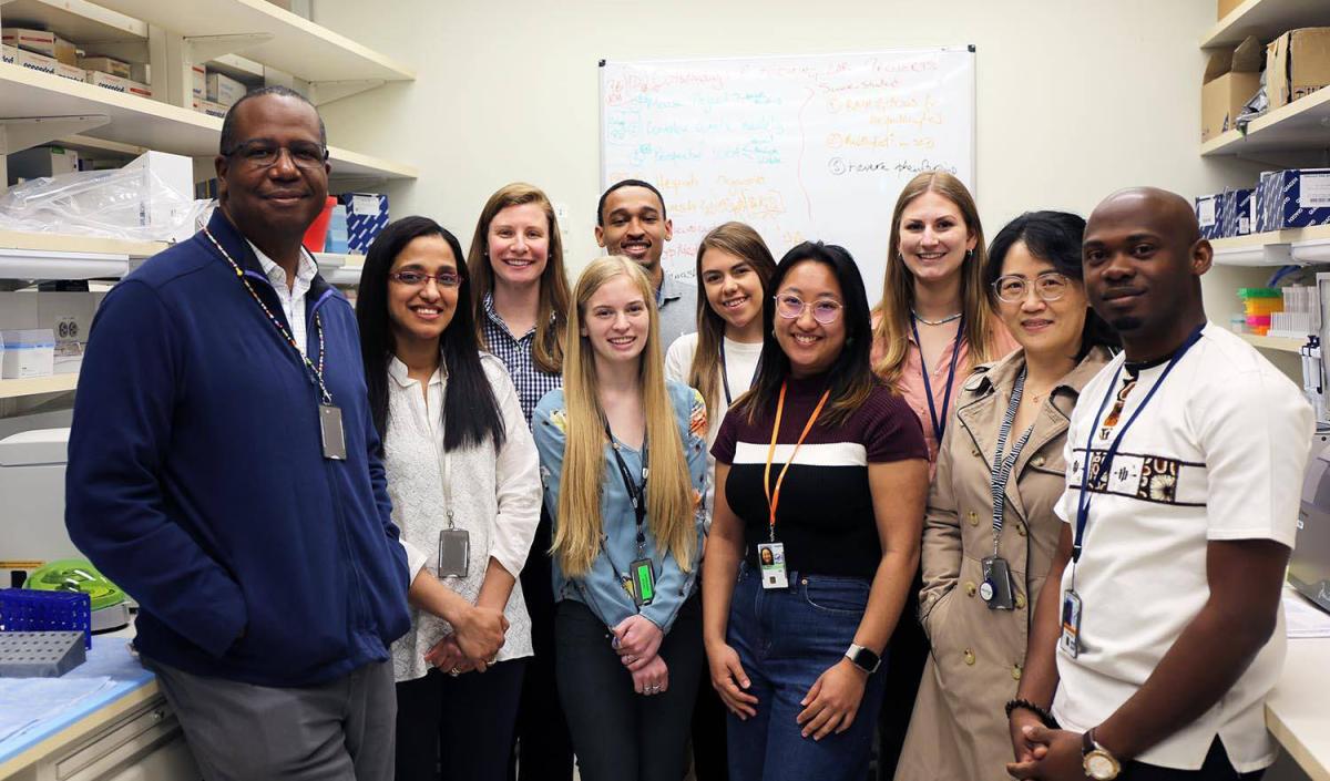 Dr. Neil Hanchard with members of his lab