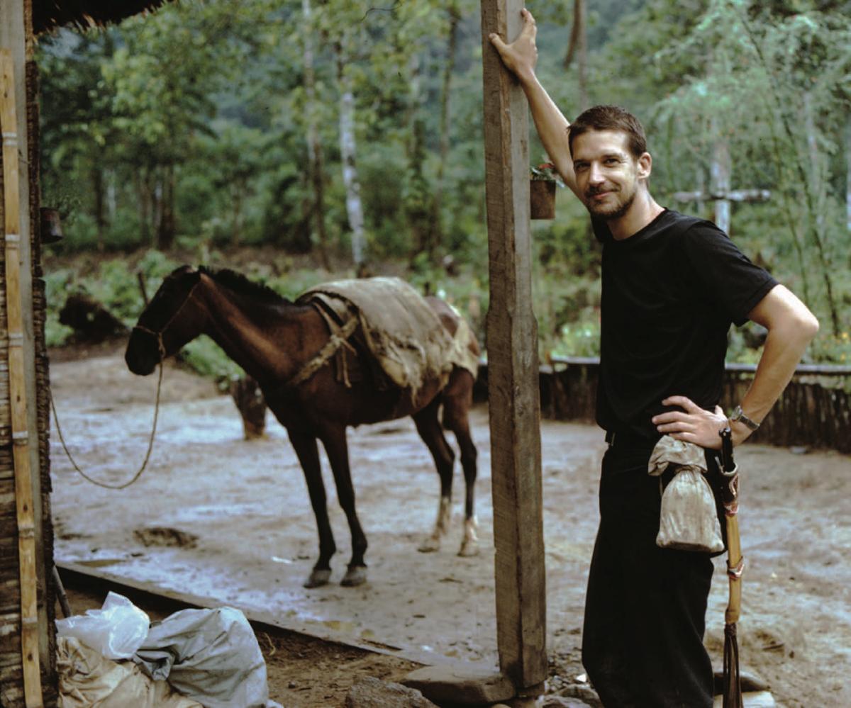 John Daly and a pack horse in the Columbian jungle