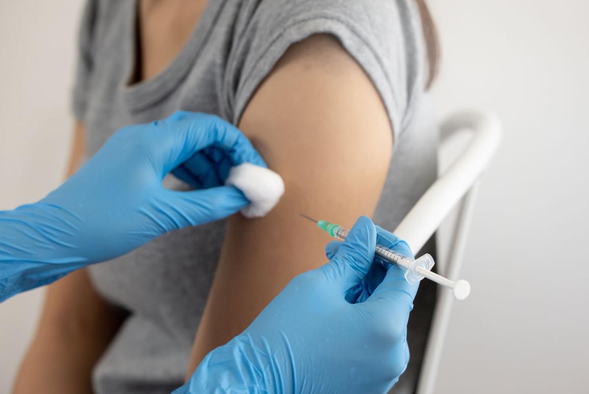 person receiving a vaccine injection