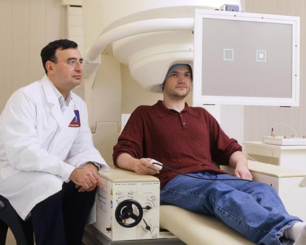 Dr. Carlos Zarate with a participant in a neuroimaging study
