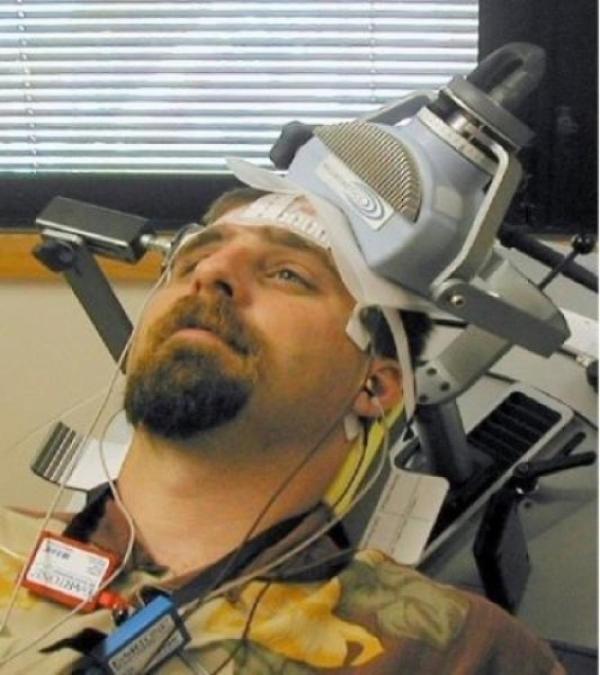 man receiving TMS brain stimulation