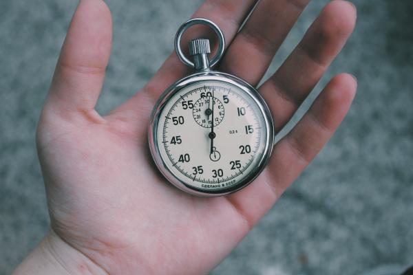 person holding a stopwatch