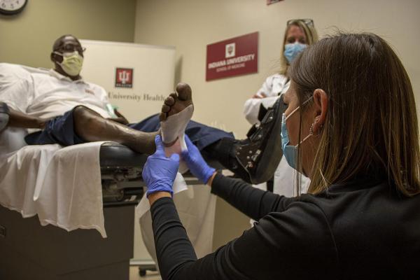 patient having his foot examined