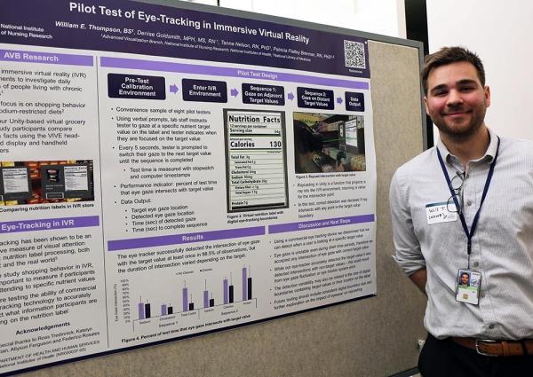 IRP postbac fellow William Thompson with his poster at Postbac Poster Day