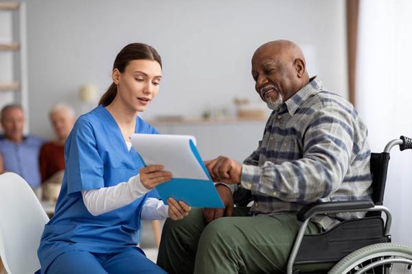 black man speaking with a nurse