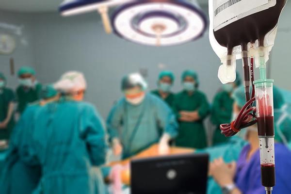 a patient receiving blood during a surgery