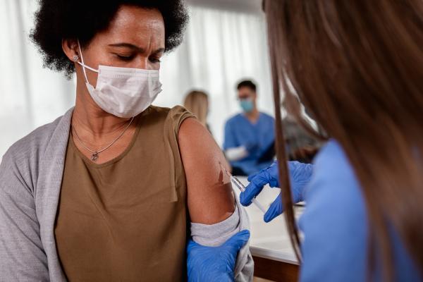 person receiving a vaccine shot