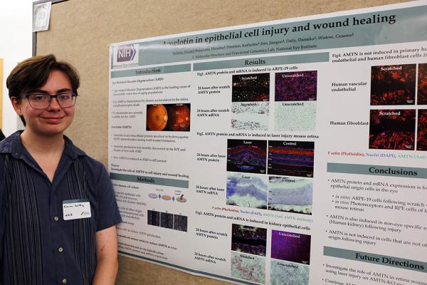 Kieran Soliday poses with his poster at Summer Poster Day