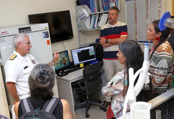 Richard Childs speaking to tribal leaders in a lab