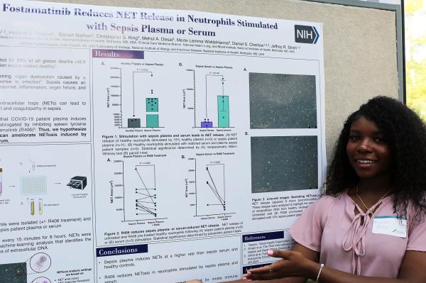 IRP postbaccalaureate fellow Kiana Allen with her poster at Postbac Poster Day