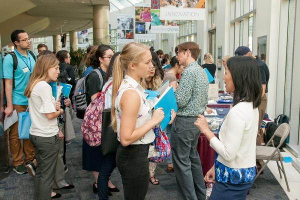 atendees chatting at the NIH Graduate and Professional School Fair