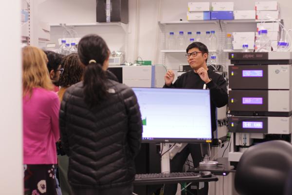 Andy Qi giving a tour of the proteomics equipment at CARD