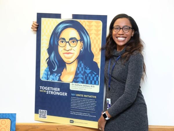 Sadhana Jackson holding her UNITE portrait