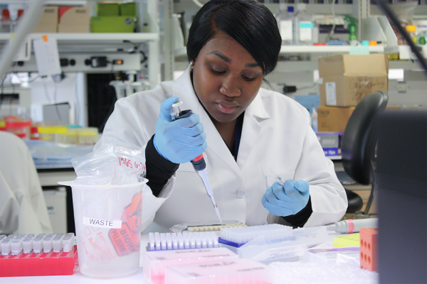 lab manager Britney Kruah preparing samples for DNA analysis