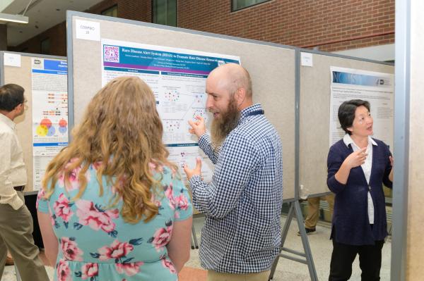 attendees at NIH research festival poster session