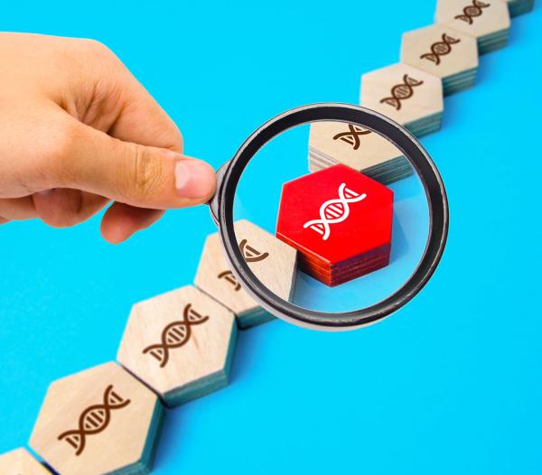 magnifying glass highlighting a DNA mutation