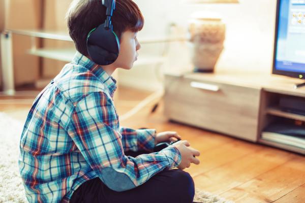 young boy playing video games