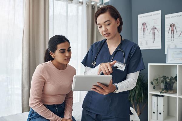 young woman talking to her doctor