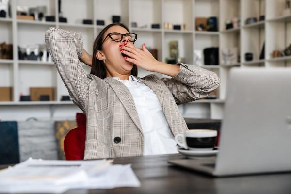 woman yawning at work