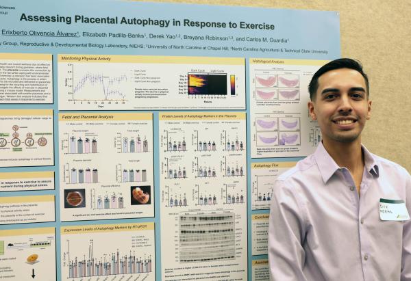 IRP postbac fellow Erixberto Alvarez with his research poster