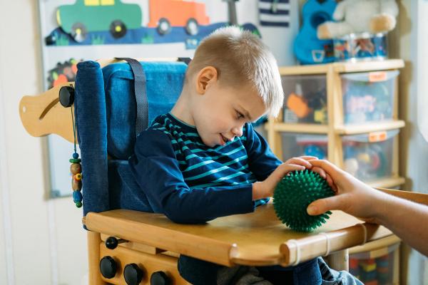 boy with cerebral palsy receiving physical therapy