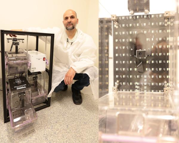IRP Ideas Lab engineer Ghadi Salem, Ph.D., with the mouse monitoring system he led the development of