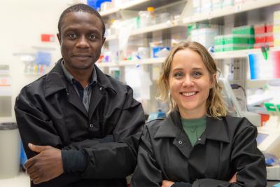 man and woman wearing black lab coats