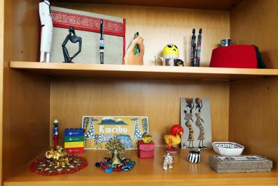 trinkets on shelves in Dr. Neil Hanchard's office from his travels in Africa