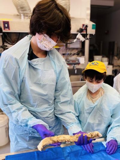 boys in scrubs in NIH lab