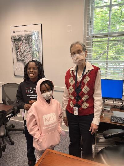 children pose with Nina Schor