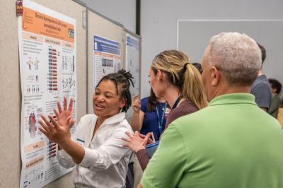 IRP postbac research fellow presents a poster at an IRP poster day event