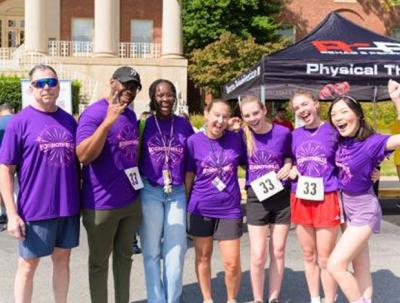 NIAID’s Knaunong “Birdy” Xiong (far-right) wears a pink and purple headband—the colors of eosinophils, a type of white blood cell. She ran with postbacs, fellows and staff scientists on team Eosinothrills