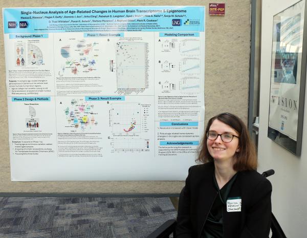 IRP postbaccalaureate fellow Monica Mesecar with her poster at Postbac Poster Day